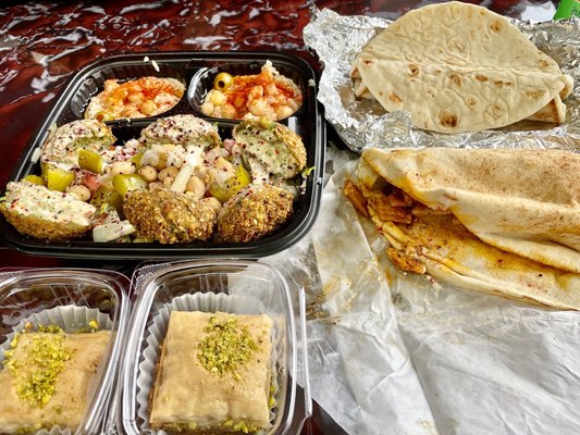 Falafel plate, sub the baba ganoush (contains dairy) for extra hummus. Vegan shawarma sandwich! Two vegan baklava!