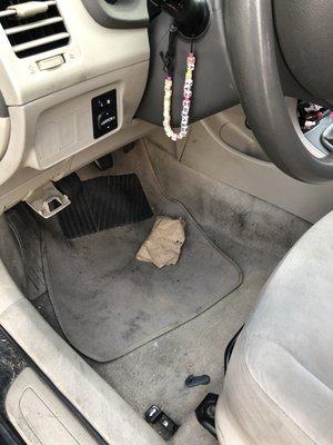 Oil stained foot prints on floor mats and obd compartment left open.