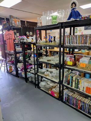 We have books, movies, dishes, glassware, & TJ's Local Merch! Lots of unique treasures!