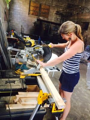 Elizabeth Hellstern learning the chop saw