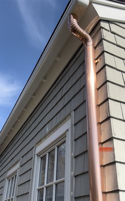 Now installing fiberglass gutters . Copper downspout's are very classy look!