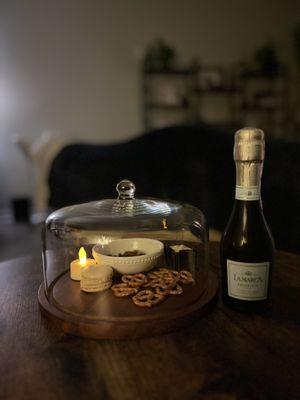 Prosecco, treats, relaxing treatment room.