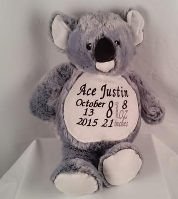 Koala bear with birth announcement.