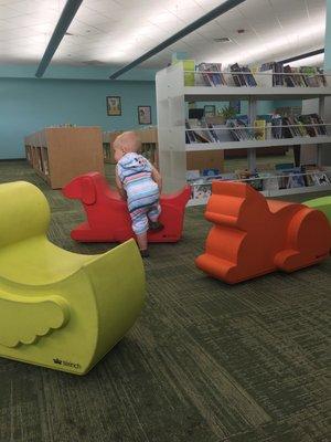 I love these soft animal shaped chairs in the baby section of library