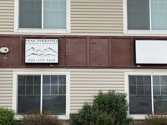 discrete outside signage on 3 story building set back from the "main road"