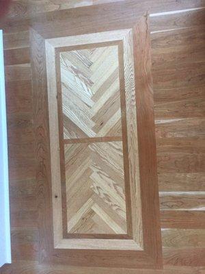 Reclaimed chestnut flooring inlay , with cherry boarder.