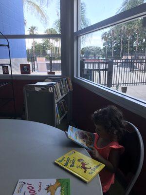 Air conditioned room with books and a view for non riders. Shade and bleachers and tables too outside.