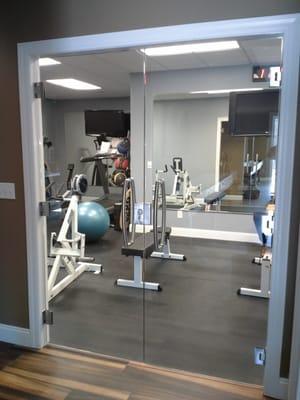 Custom glass for exercise room by St. Charles Glass & Glazing.