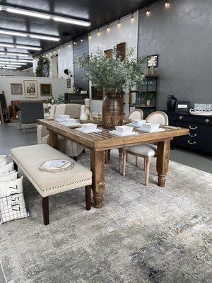 One-of-a-kind furniture pieces like this Dining Table made from a Yoss Dairy Farm Barn Door atop 1887 Porch Pillars from Prague, Oklahoma.