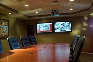 A dual-monitor set up preformed by Fearing's Audio and Video Security. Our solutions are all custom fit and designed to fit y...