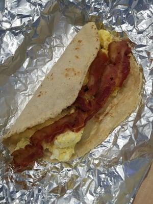 Bacon and egg taco on homemade corn tortilla