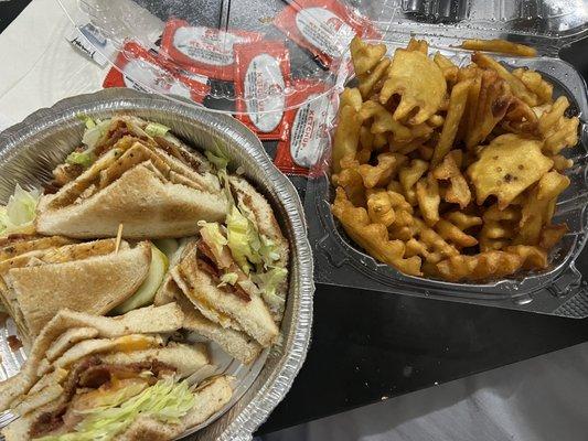 Grilled chicken club with lettuce, tomato, bacon and Mayo with a side of waffle fries