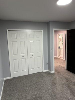 Painted ceilings, walls, and trim in bedroom 2.