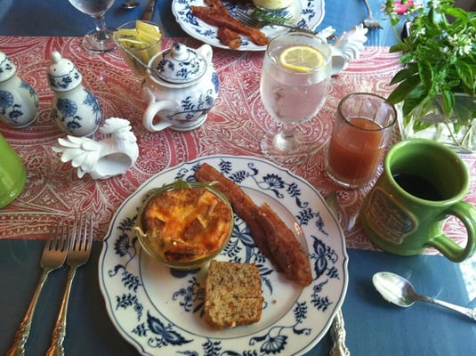 Breakfast! Delicious cheese soufflé, local peppered bacon, and homemade apricot-nut bread.