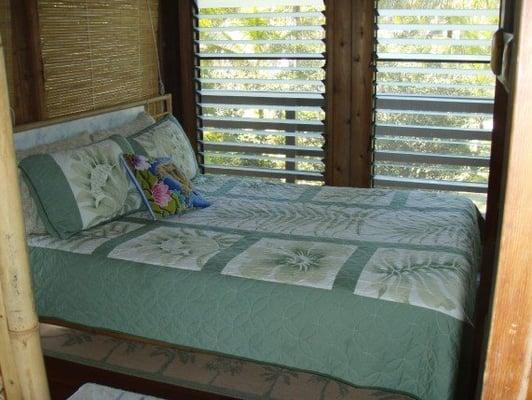 Queen size bed in upstairs bedroom, Pualani Home in Kapoho, Big Island Hawaii