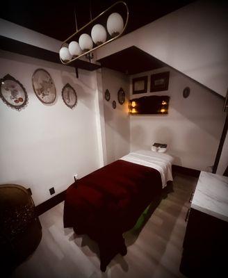 Step into the gateway of tranquility, where the boundaries of time blur and the journey of healing embraces you in our serene massage room.