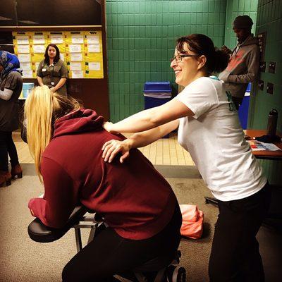 Stretching the back and shoulders. Don't you want a chair massage at your local business office?