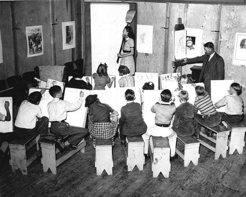 Children on scholarship take a drawing class in 1948.