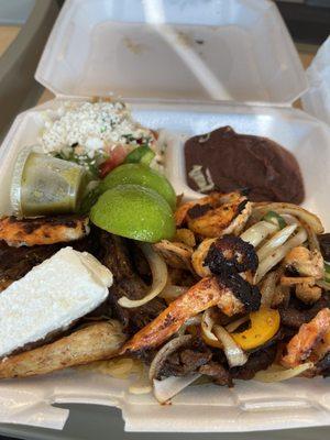 Platillo mixto. It's a mixed plate. Chicken, steak, and shrimp with a rice, beans, salad, and 4 tortillas.