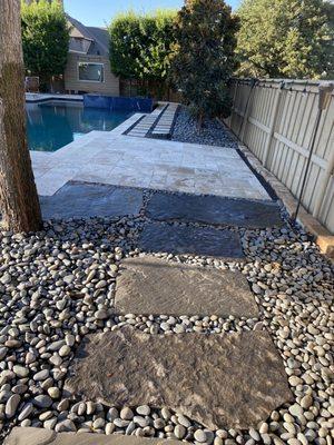 From Firepit leads to a nice lounge Travertine Paver area next to the pool.