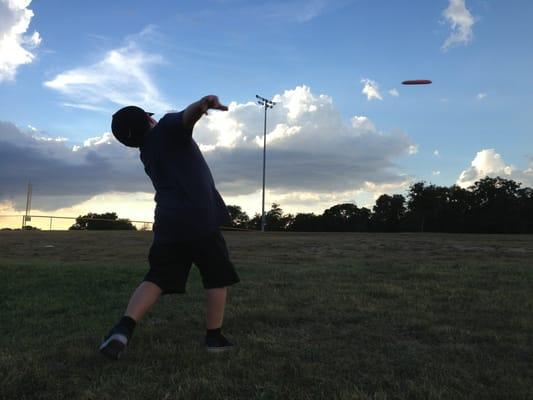 8 year old son rippin' a drive at San Gabriel Disc Golf Course.