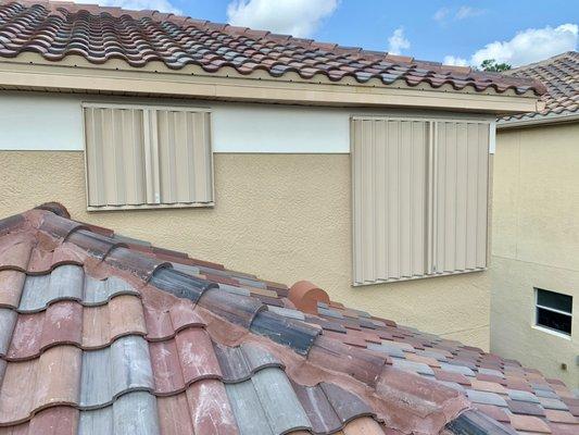 Closed accordion shutters installed on home in Bella Terra, Estero, FL