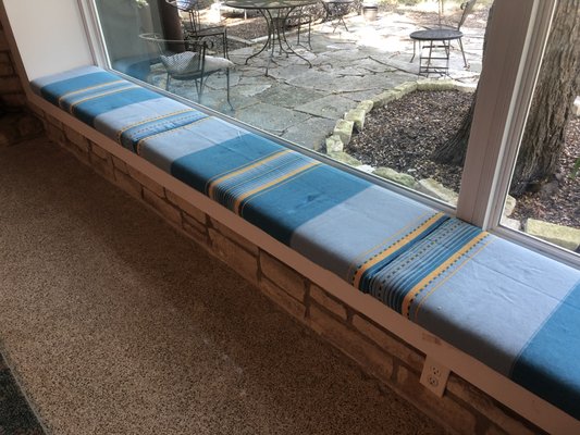 Bench cushion. I gave them a custom-cut foam and a tablecloth from Mexico.