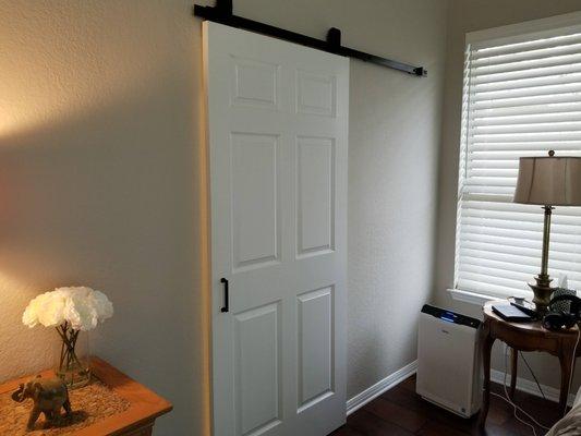 new barn door between bedroom and bath