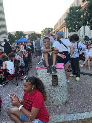 Waiting on the fireworks. Sam Impatiently waiting for his Greek dinner  from the food truck