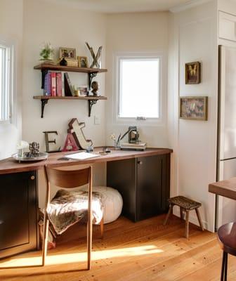 The wife, a profession chef, requested this office space adjacent to the kitchen so she could go back and forth between cooking and filing.