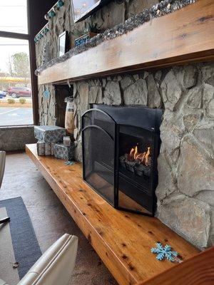 Tables available next to this cozy fireplace