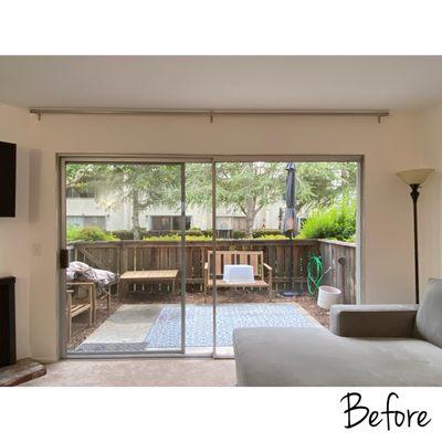 Living room with old ugly aluminum trim.