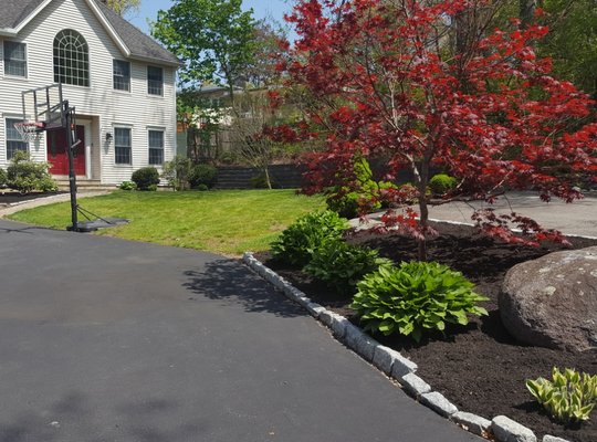 Lawn maintenance and mulching services.