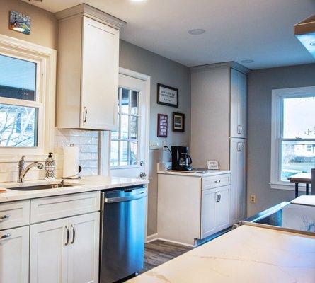 Modern Kitchen with white cabinet and subway backsplash Design and installed by Aladdin carpet and floors