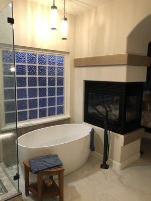 Freestanding tub with marble wainscot