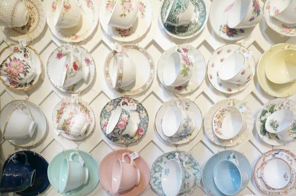 The wall of English tea cups on the way up the stairs!