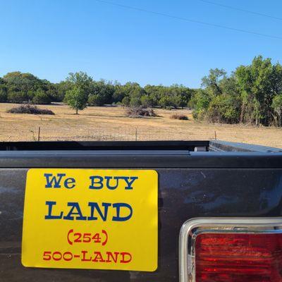 We buy land sign