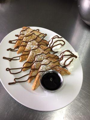 French Toast with Vanilla, Cinnamon, Nutella and just a little bit of whipped cream to start or end the day!!