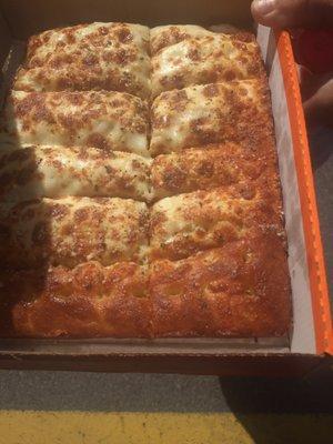 Half cheesed and buttered Italian cheese bread. What a joke and the male manager said he just made these. Good luck little Caesars