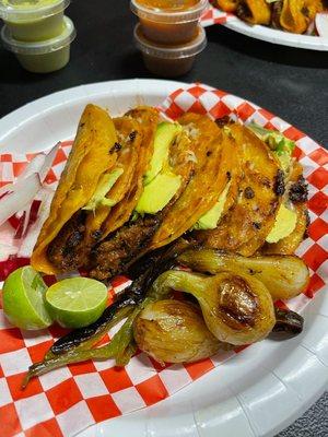 Tacos de adobads with cheese and avocado