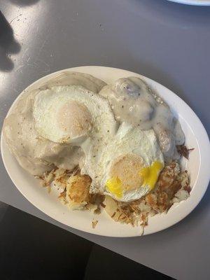 Biscuits and gravy with over easy eggs and hash browns