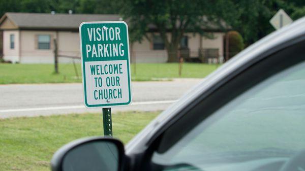 2 - As you enter the main parking lot, the parking spaces closest to the building are for new visitors.