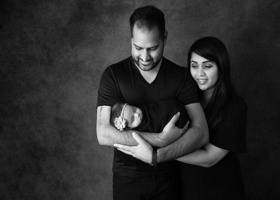 Family photo in black and white with newborn girl