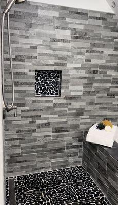 Design and install by Maeko. Framing, wat walling, tiling, grout, soak tub set in, plumbing, plumbing fixtures installed.