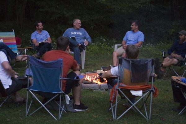 Men's ministry meeting around the bonfire.