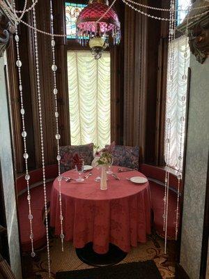 Cozy romantic dining cove at Alfred's Victorian