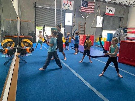 Coach Keaton teaching the parkour class how to be little ninjas!