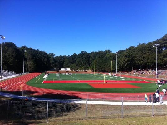 Back field w/ track and artificial turf....