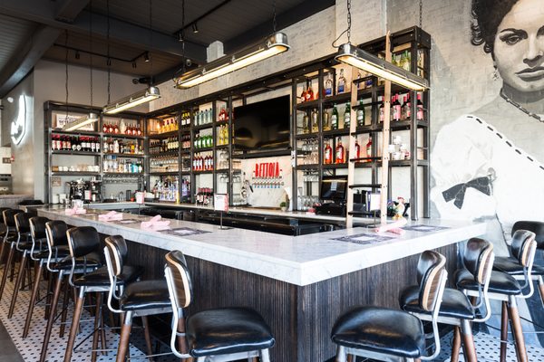 The bar, fully stocked with unique beer, wine and spirits.