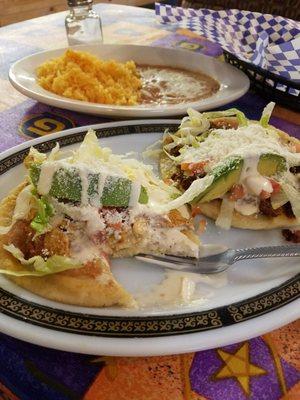 Chorizo and chicken sopes with beans and rice.